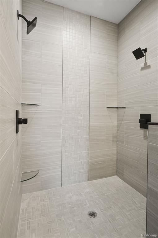 bathroom with tiled shower