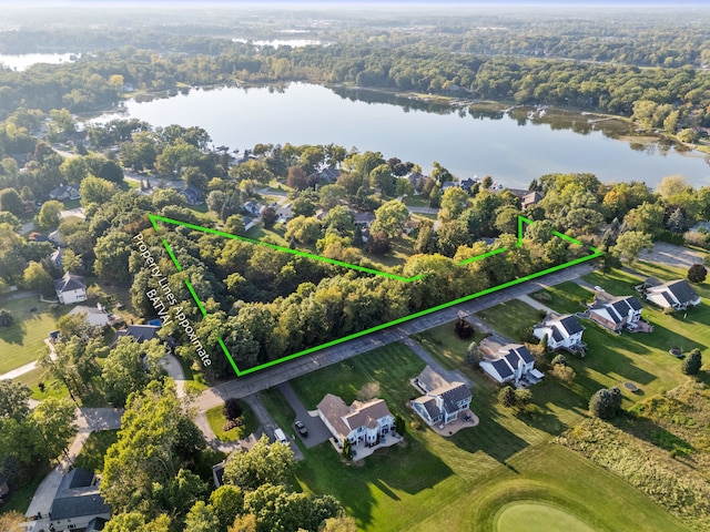 aerial view featuring a water view and a residential view