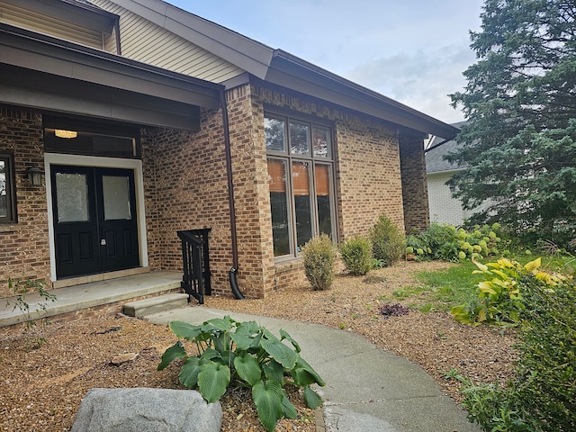 view of side of home featuring brick siding