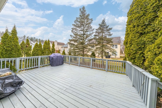 deck featuring a residential view and grilling area