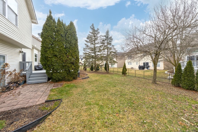 view of yard featuring a patio area and fence