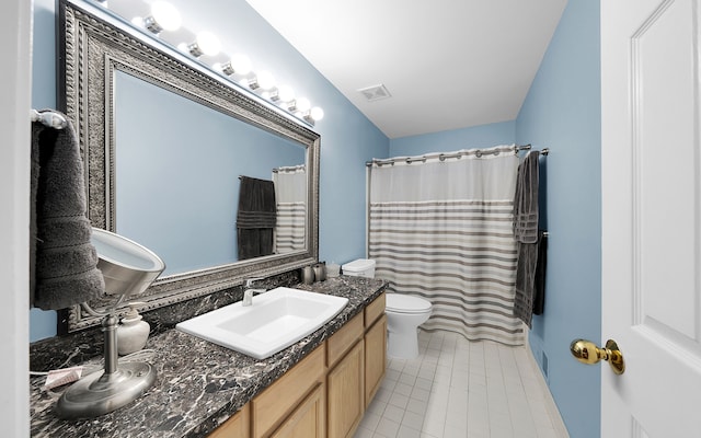 full bath with vanity, a shower with shower curtain, visible vents, tile patterned floors, and toilet