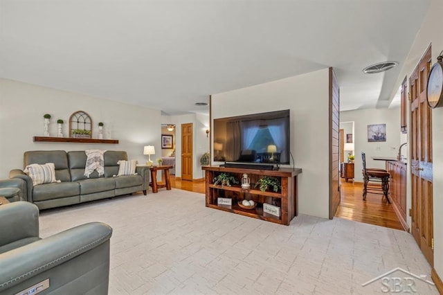 living room featuring visible vents