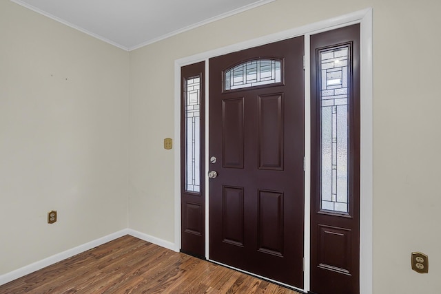 entryway featuring baseboards, ornamental molding, and dark wood finished floors