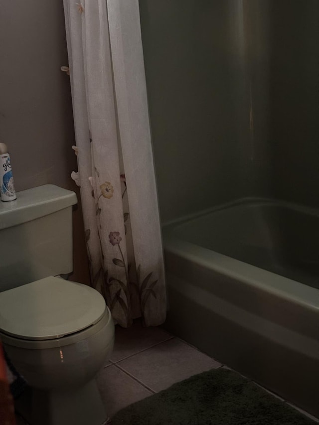 full bath featuring tile patterned flooring and toilet