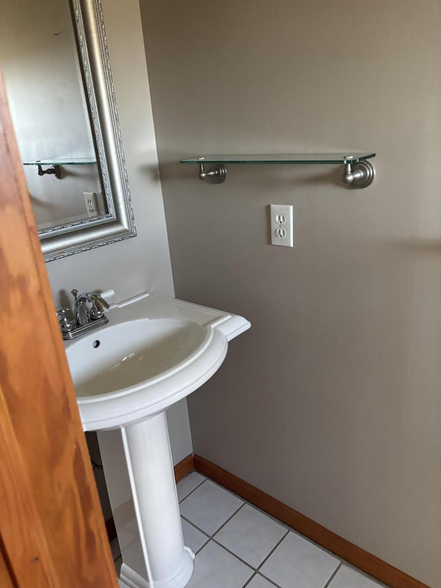 bathroom featuring tile patterned flooring and baseboards