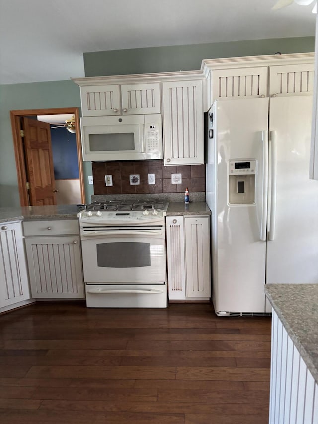 kitchen featuring a ceiling fan, white appliances, dark wood-type flooring, and tasteful backsplash