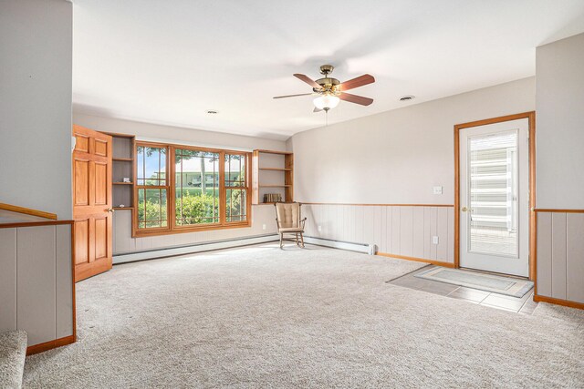 222 Crockett Dr, Quincy, MI 49082 - carpeted spare room featuring ceiling fan and wainscoting