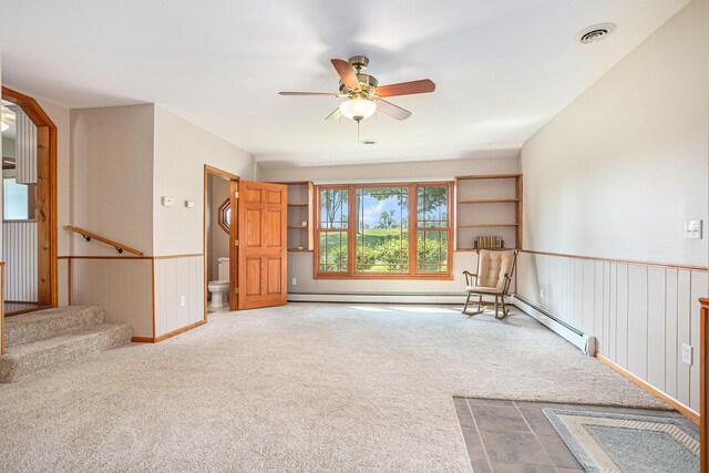222 Crockett Dr, Quincy, MI 49082 - unfurnished room featuring carpet flooring, ceiling fan, a baseboard heating unit, wainscoting, and stairs