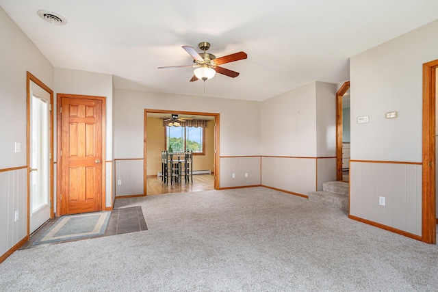 222 Crockett Dr, Quincy, MI 49082 - carpeted empty room with ceiling fan and stairs