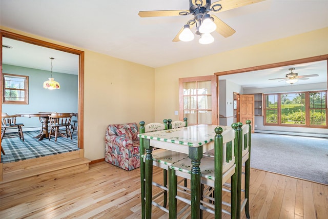 222 Crockett Dr, Quincy, MI 49082 - dining space with light wood-type flooring, ceiling fan, and plenty of natural light
