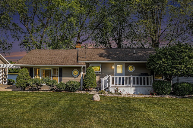 222 Crockett Dr, Quincy, MI 49082 - ranch-style house featuring a porch, a yard, and a shingled roof