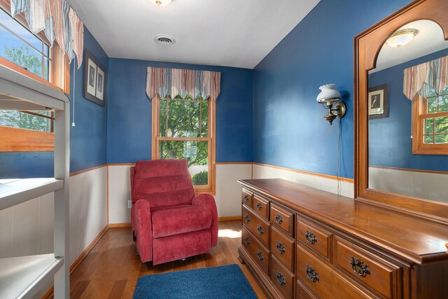 222 Crockett Dr, Quincy, MI 49082 - sitting room with wood finished floors, wainscoting, and healthy amount of natural light
