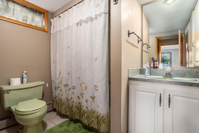 222 Crockett Dr, Quincy, MI 49082 - full bath with baseboard heating, tile patterned floors, vanity, and curtained shower