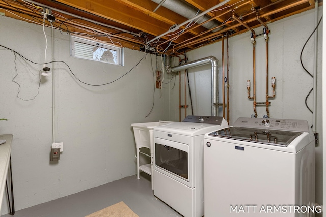 clothes washing area featuring laundry area and washer and dryer