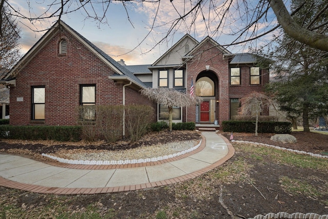 traditional home with brick siding