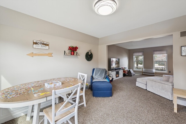 view of carpeted dining area