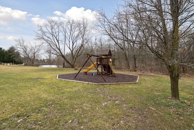 view of jungle gym featuring a water view and a lawn