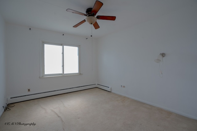 empty room featuring light carpet, ceiling fan, and a baseboard heating unit