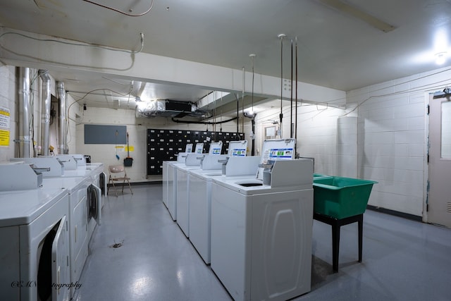 shared laundry area featuring washer and clothes dryer