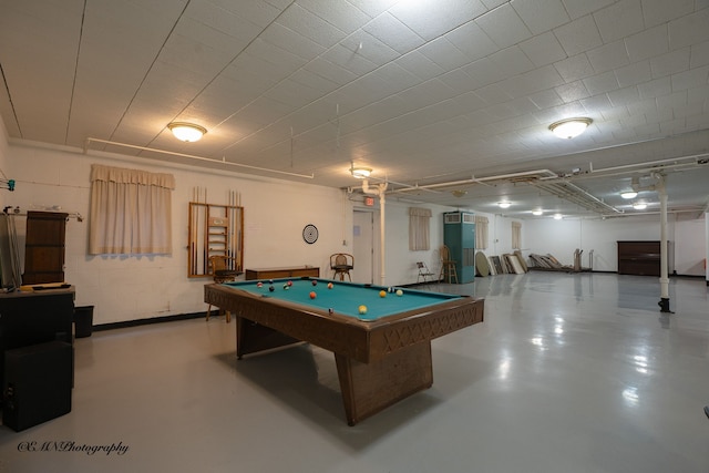 recreation room featuring concrete block wall, pool table, and concrete floors