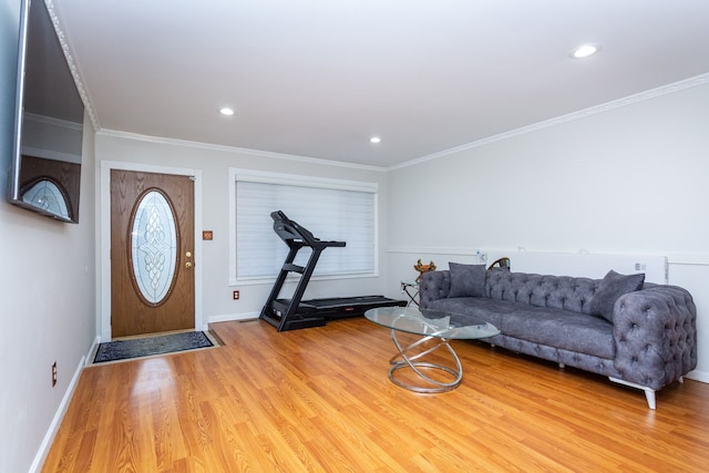 living area featuring ornamental molding, recessed lighting, baseboards, and wood finished floors