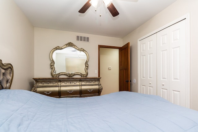 bedroom with a closet, visible vents, and a ceiling fan