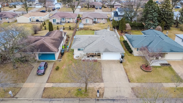 birds eye view of property with a residential view