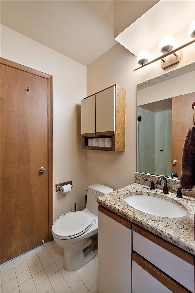 full bath with tile patterned floors, toilet, and vanity