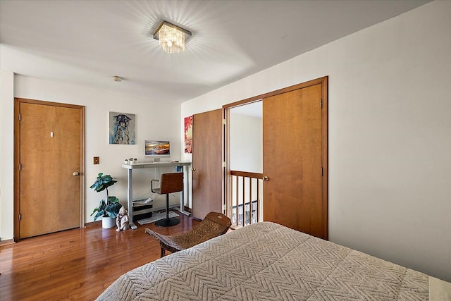 bedroom with wood finished floors