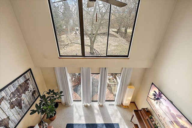 interior space featuring a towering ceiling