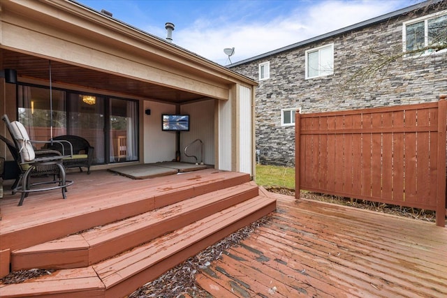 wooden deck featuring fence