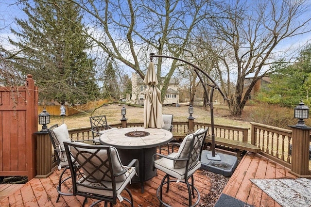 wooden deck with outdoor dining area