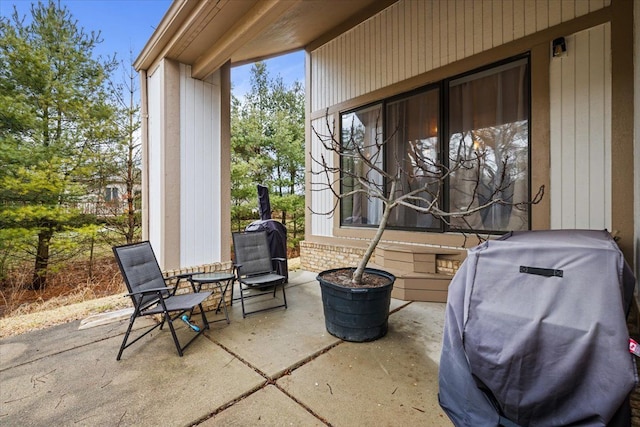 view of patio featuring a grill