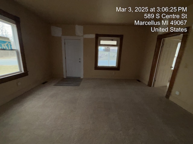 spare room featuring plenty of natural light