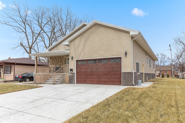 view of front of property featuring concrete driveway, a front lawn, a porch, and brick siding