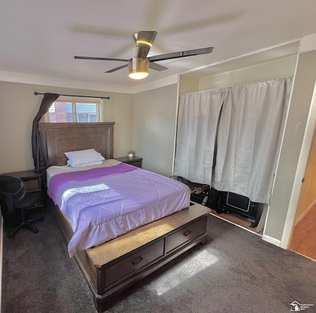 carpeted bedroom with ceiling fan