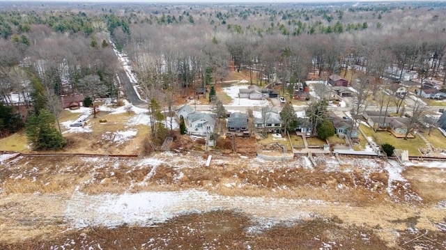 birds eye view of property with a forest view and a residential view