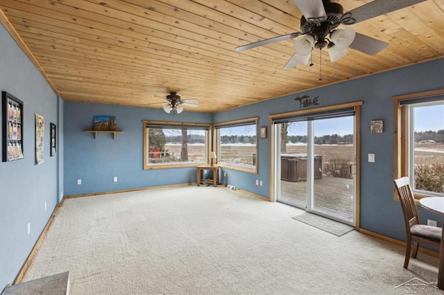 interior space featuring carpet floors, wooden ceiling, a sunroom, and baseboards