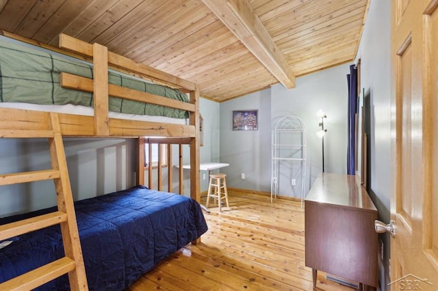 bedroom with vaulted ceiling with beams, wooden ceiling, and wood-type flooring