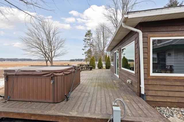 wooden terrace featuring a hot tub