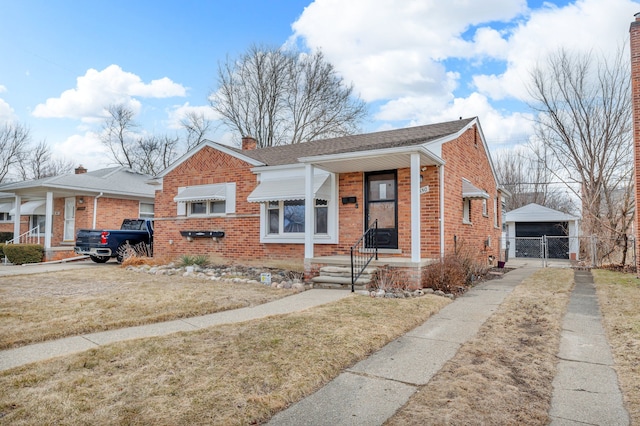 bungalow-style house featuring a garage, brick siding, a shingled roof, a gate, and a chimney