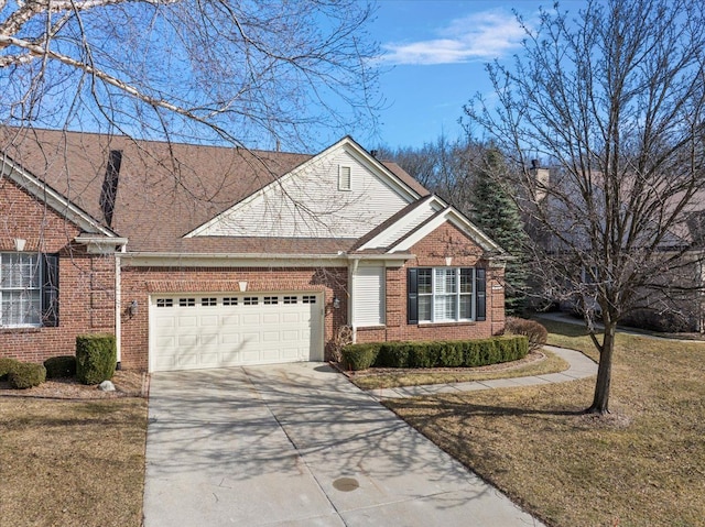 view of front of property featuring brick siding, a front lawn, an attached garage, and driveway