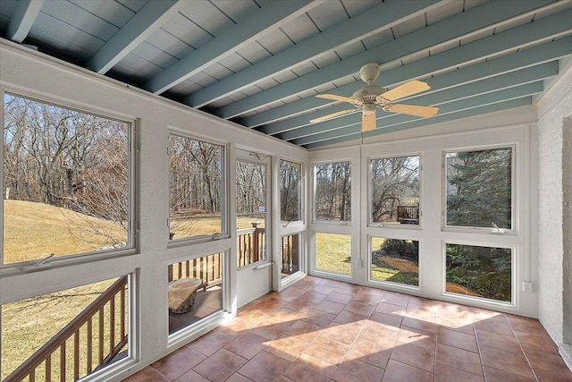 unfurnished sunroom with beam ceiling, wood ceiling, and ceiling fan