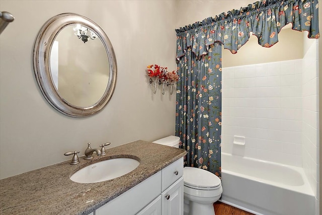 full bathroom featuring vanity, toilet, and shower / tub combo with curtain