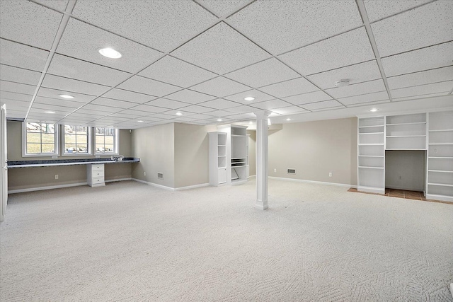 basement featuring recessed lighting, baseboards, and light carpet