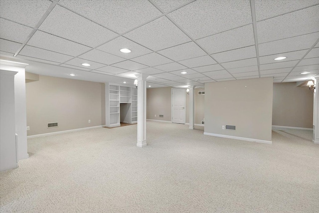 finished basement featuring visible vents, baseboards, and carpet