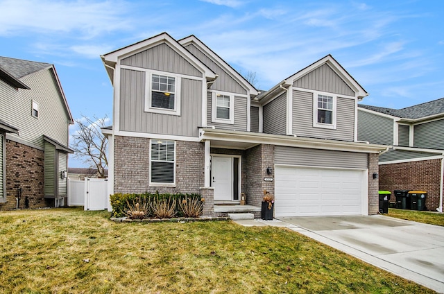 view of front of property with concrete driveway, an attached garage, a front yard, board and batten siding, and brick siding