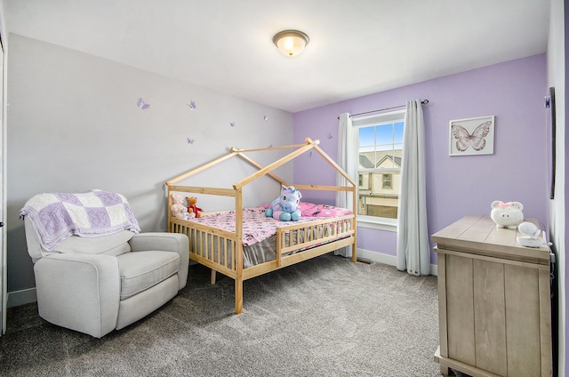 carpeted bedroom with baseboards