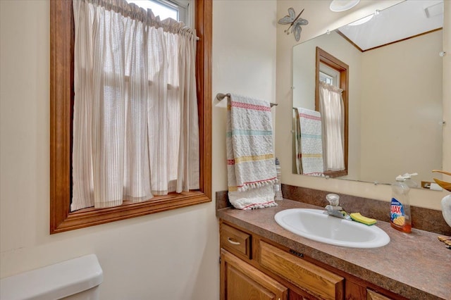 bathroom featuring toilet and vanity